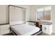 Bedroom with Murphy bed, built-in desk, and window at 12860 W Calle De Sol --, Peoria, AZ 85383