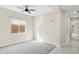 Well-lit bedroom featuring carpet and a ceiling fan at 12860 W Calle De Sol --, Peoria, AZ 85383