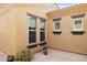 Exterior view of a courtyard with brick pavers and potted plants at 12860 W Calle De Sol --, Peoria, AZ 85383