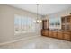 Bright dining area with built-in cabinetry and large windows at 12860 W Calle De Sol --, Peoria, AZ 85383