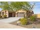 Two-story house with a two car garage and desert landscaping at 12860 W Calle De Sol --, Peoria, AZ 85383