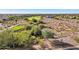 Aerial view of a golf course and surrounding desert landscape at 12860 W Calle De Sol --, Peoria, AZ 85383