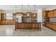 Gourmet kitchen with granite countertops and custom cabinetry at 12860 W Calle De Sol --, Peoria, AZ 85383
