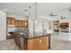 Open kitchen with large island and views to Gathering room at 12860 W Calle De Sol --, Peoria, AZ 85383