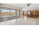 Open kitchen with island, stainless steel appliances, and backyard access at 12860 W Calle De Sol --, Peoria, AZ 85383