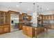 Island kitchen with stainless steel appliances and granite countertops at 12860 W Calle De Sol --, Peoria, AZ 85383