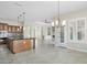 Spacious kitchen featuring a large island, modern cabinetry, and tile flooring at 12860 W Calle De Sol --, Peoria, AZ 85383