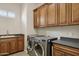 Laundry room with cabinets and a sink at 12860 W Calle De Sol --, Peoria, AZ 85383