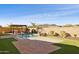 Resort-style backyard oasis featuring a pool, pergola, and BBQ area at 12860 W Calle De Sol --, Peoria, AZ 85383