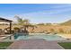 Inviting backyard pool with brick patio and water features at 12860 W Calle De Sol --, Peoria, AZ 85383