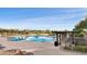 Community pool with lounge chairs and shaded seating areas at 12860 W Calle De Sol --, Peoria, AZ 85383