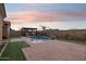Tranquil pool and patio at sunset, mountain backdrop at 12860 W Calle De Sol --, Peoria, AZ 85383