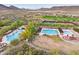 Aerial view of community pools, tennis, and pickleball courts at 12860 W Calle De Sol --, Peoria, AZ 85383