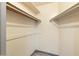 Large walk-in closet with double hanging rods and shelving at 13844 N 111Th Ave, Sun City, AZ 85351