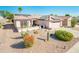 Single story home with solar panels and desert landscaping at 16232 W Silver Falls Dr, Surprise, AZ 85374