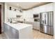 Updated kitchen featuring white cabinets and stainless steel appliances at 16232 W Silver Falls Dr, Surprise, AZ 85374