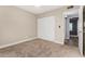 Bright bedroom with neutral walls and carpet, featuring a large closet at 19601 N 7Th St # 1001, Phoenix, AZ 85024