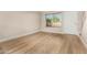 Light and airy living room featuring wood-look flooring and neutral walls at 19601 N 7Th St # 1001, Phoenix, AZ 85024