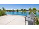 Serene lakefront view with a bench and gazebo in background at 4758 S Pluto --, Mesa, AZ 85212