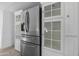 Stainless steel refrigerator and white shaker cabinets at 5311 W Mountain View Rd, Glendale, AZ 85302