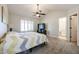 Bright bedroom with ensuite bathroom access and a ceiling fan at 5820 W Morelos St, Chandler, AZ 85226