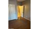 Bedroom with double door closet and wood-look floors at 633 E Leslie Ave, San Tan Valley, AZ 85140