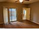 Bedroom with patio access and ceiling fan at 633 E Leslie Ave, San Tan Valley, AZ 85140