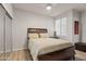 Spacious bedroom with mirrored closet doors and neutral decor at 7009 E Acoma Dr # 1105, Scottsdale, AZ 85254