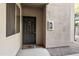 Private entrance to condo with dark brown door at 7009 E Acoma Dr # 1105, Scottsdale, AZ 85254