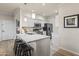 Modern kitchen with stainless steel appliances and white cabinets at 7009 E Acoma Dr # 1105, Scottsdale, AZ 85254