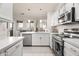 Modern kitchen with stainless steel appliances and white cabinets at 7009 E Acoma Dr # 1105, Scottsdale, AZ 85254