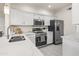 Modern kitchen with stainless steel appliances and white cabinets at 7009 E Acoma Dr # 1105, Scottsdale, AZ 85254
