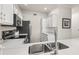 Modern kitchen with stainless steel appliances and white cabinets at 7009 E Acoma Dr # 1105, Scottsdale, AZ 85254