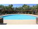 Community pool with surrounding lounge chairs at 7009 E Acoma Dr # 1105, Scottsdale, AZ 85254