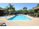 Community lap pool with lounge chairs at 7009 E Acoma Dr # 1105, Scottsdale, AZ 85254