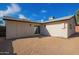 Side view of single-story house, light-colored exterior, and gravel yard at 7757 N 18Th Ave, Phoenix, AZ 85021