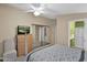 Bedroom with mirrored closet doors and TV at 8500 E Southern Ave # 368, Mesa, AZ 85209