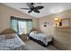 Bedroom with two twin beds and ceiling fan at 8500 E Southern Ave # 368, Mesa, AZ 85209