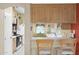 Kitchen with light wood cabinets and a breakfast bar at 8500 E Southern Ave # 368, Mesa, AZ 85209