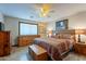 Spacious bedroom with wooden furniture and southwestern decor at 8926 E Malorie Ln, Coolidge, AZ 85128