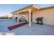 Covered patio with seating area and built-in grill at 8926 E Malorie Ln, Coolidge, AZ 85128