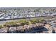 Wide aerial view of a neighborhood with various housing types and a main road at 9539 E Belmont Ave, Mesa, AZ 85208