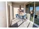 Relaxing screened porch with table and chairs for outdoor dining at 9643 E Twinkle Cir, Mesa, AZ 85212