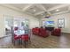 Open dining area with glass table, red chairs, and living room access at 10125 E Cortez Dr, Scottsdale, AZ 85260