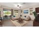 Living room with sliding doors to backyard and comfy seating at 10320 E Tahoe Ave, Mesa, AZ 85212