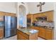 Modern kitchen with island, stainless steel appliances, and granite countertops at 11104 E White Feather Ln, Scottsdale, AZ 85262