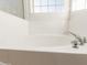 Close-up view of a clean and modern bathtub at 15009 W Glenrosa Ave, Goodyear, AZ 85395