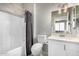 Clean bathroom with shower/tub combo and white vanity at 15971 W La Paloma Dr, Surprise, AZ 85374