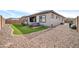 Spacious backyard with hot tub and gravel landscaping at 16406 W Charlotte Dr, Surprise, AZ 85387