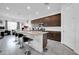 Modern kitchen with granite countertops and dark wood cabinets at 16406 W Charlotte Dr, Surprise, AZ 85387